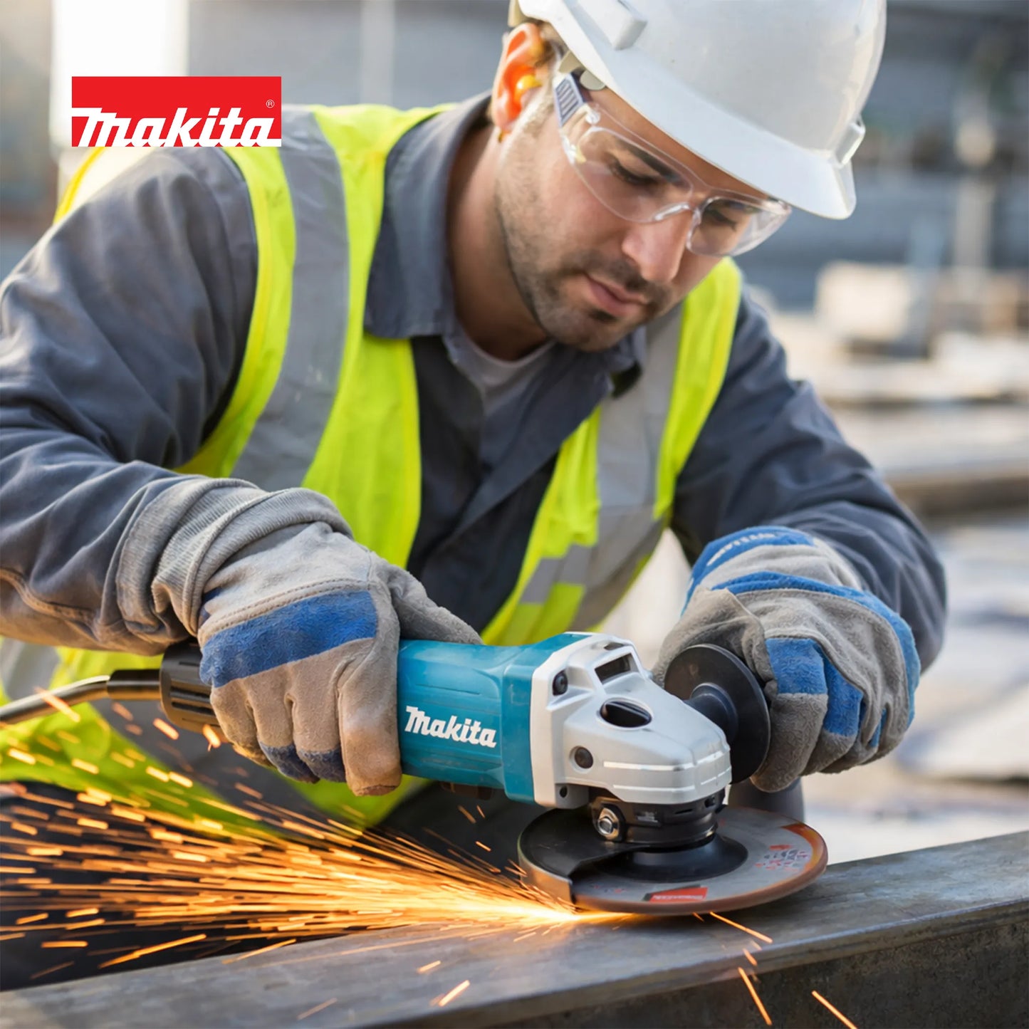 Lifestyle image of a construction worker, wearing a hard hat, safety glasses, and gloves, using a Makita GA4550R angle grinder to cut through a metal beam with a shower of sparks.