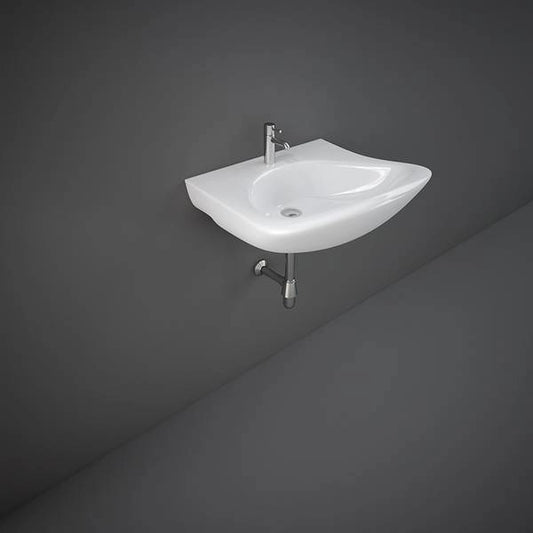 A front-facing studio shot of the RAK-Bella 61cm wall-hung disabled wash basin in Alpine White, showing its wide rectangular design and smooth rounded edges.