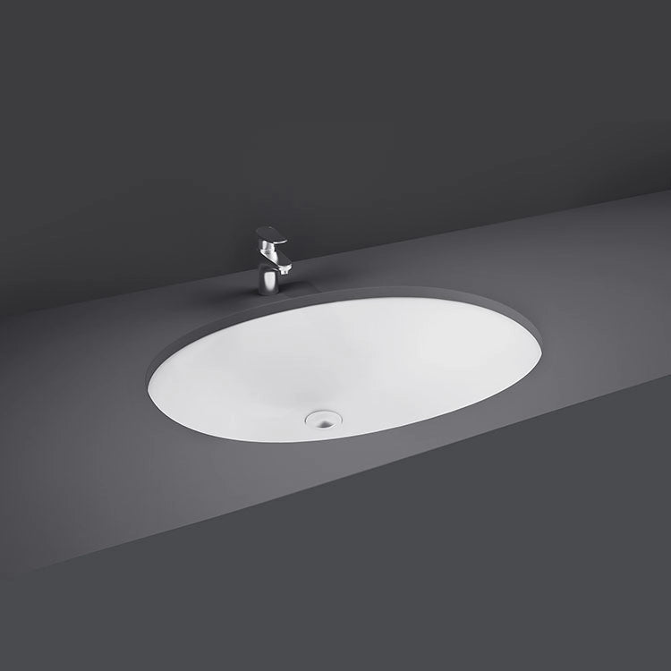 A top-down studio view of the RAK-Rosa 50cm Under Counter Wash Basin in Alpine White, showing its smooth oval basin interior and integrated overflow hole.