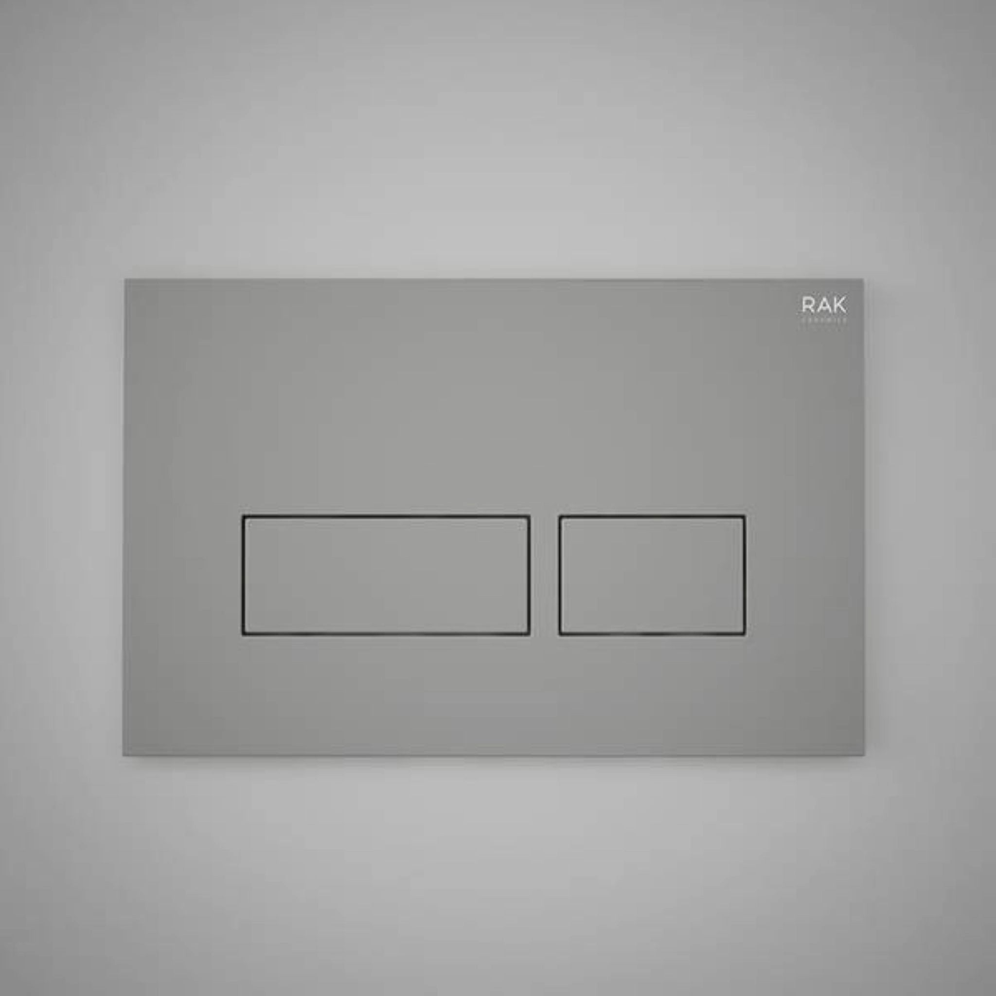 Front view of the RAK Ecofix rectangular dual flush plate in a contemporary Matt Grey finish, featuring two rectangular push buttons.