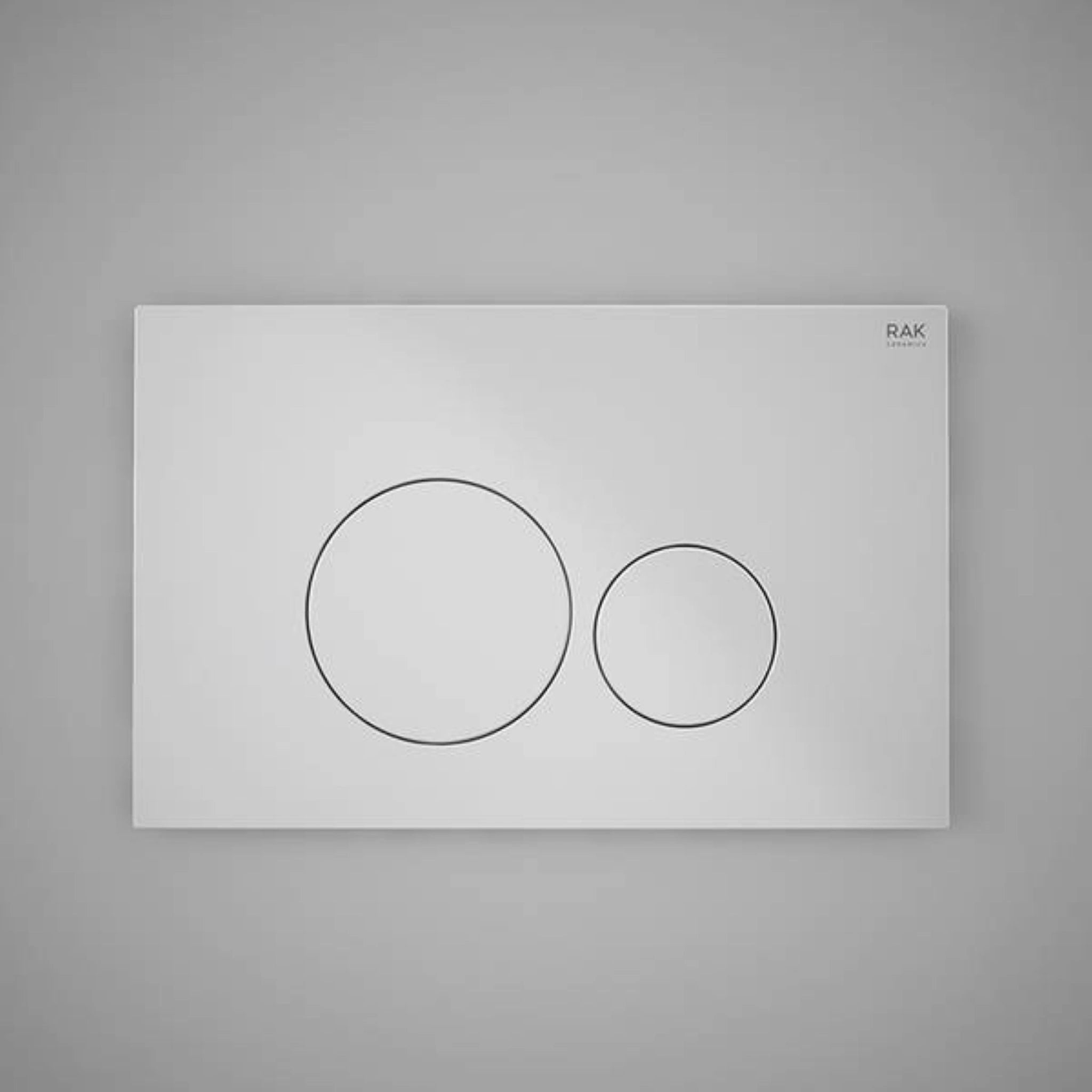 Front view of the RAK Ceramics RAK-Ecofix rectangular push plate in a brilliant White finish, featuring two circular dual-flush buttons.
