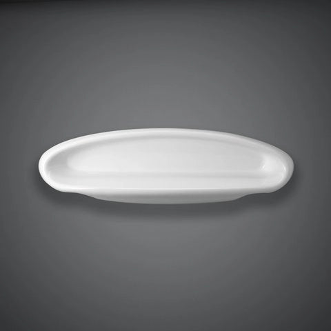 A studio shot of the RAK-Europa ceramic shelf in a smooth Ivory finish, showing its long, flat surface and rounded safety edges designed for wall mounting.