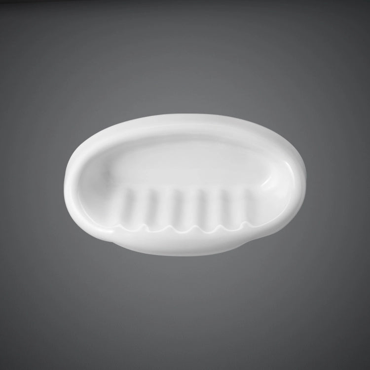 A studio shot of the RAK-Europa Small Soap Holder in Ivory, showcasing its smooth ceramic texture and compact oval design for wall installation.