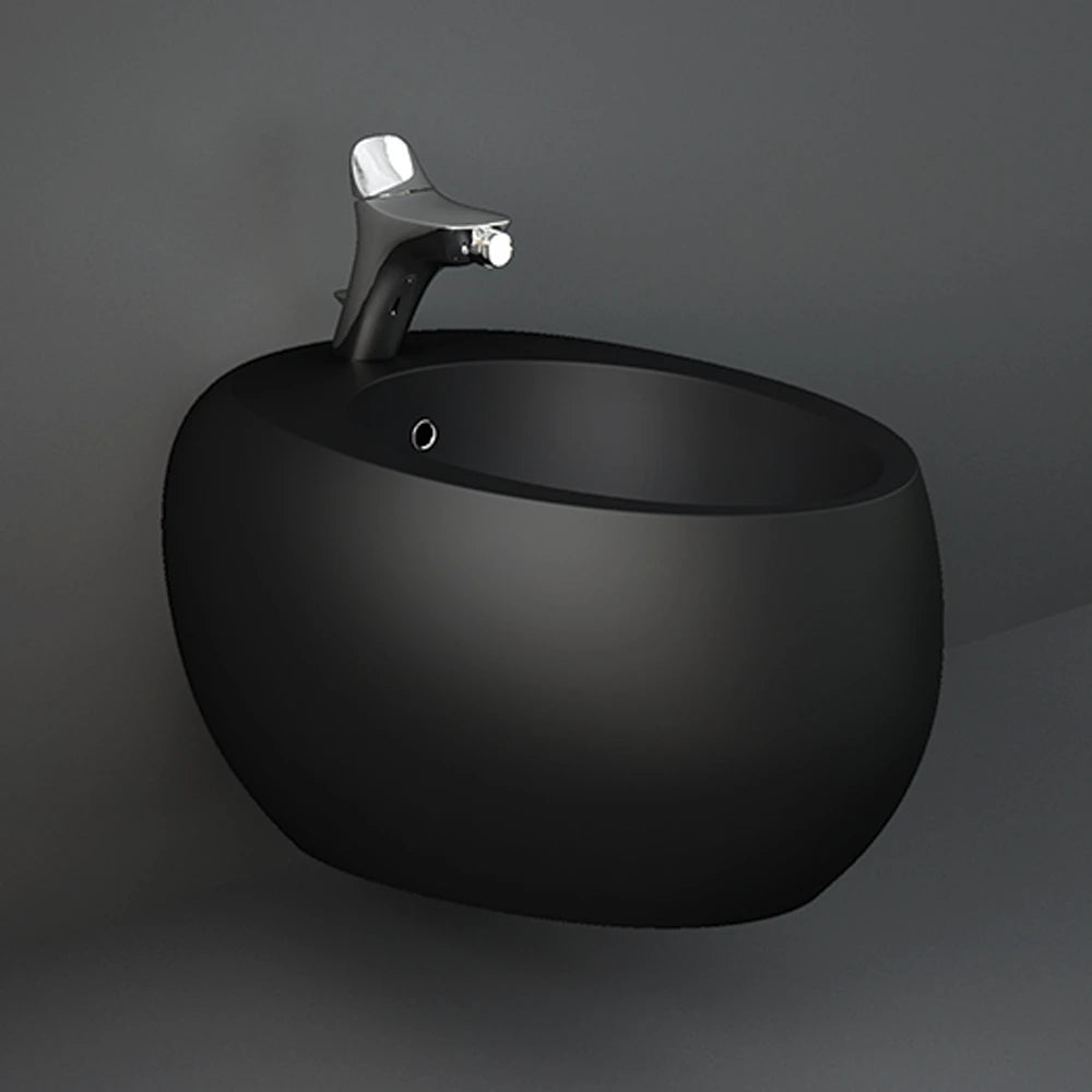 A profile studio shot of the RAK-Cloud 56cm Wall Hung Bidet in Matt Black, showcasing its distinctive floating design and smooth, curved "cloud" silhouette.