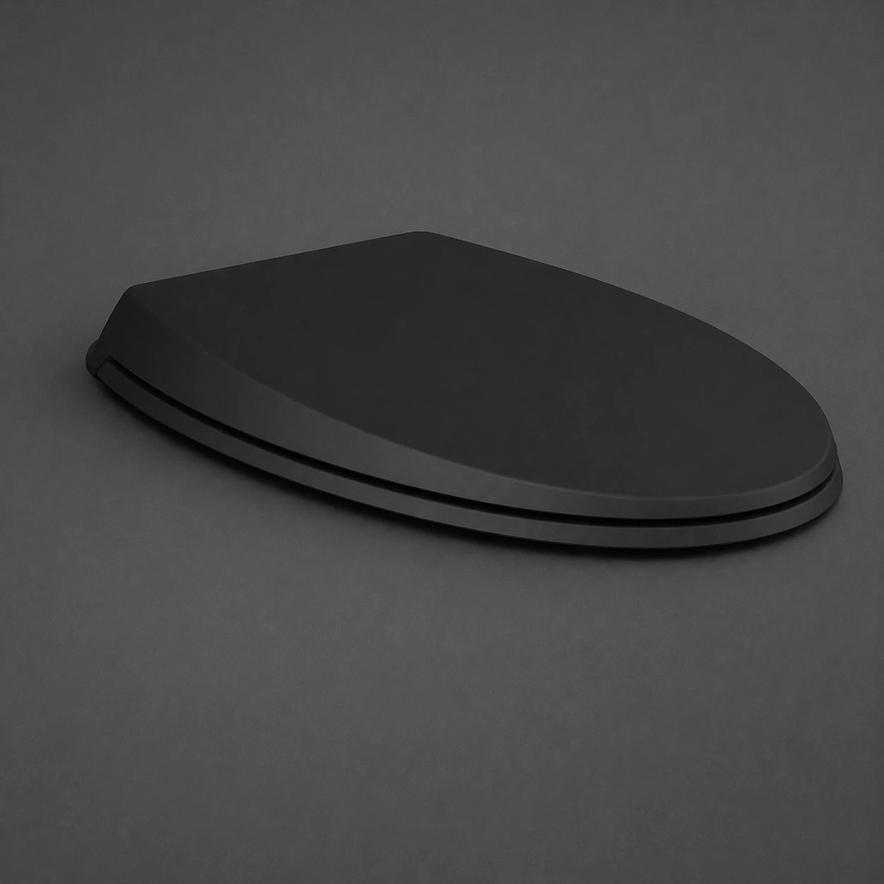 Top-down view of the RAK-Cloud Urea Soft Close Seat Cover in a sleek Matt Black finish, highlighting its unique oval shape and smooth designer contours.