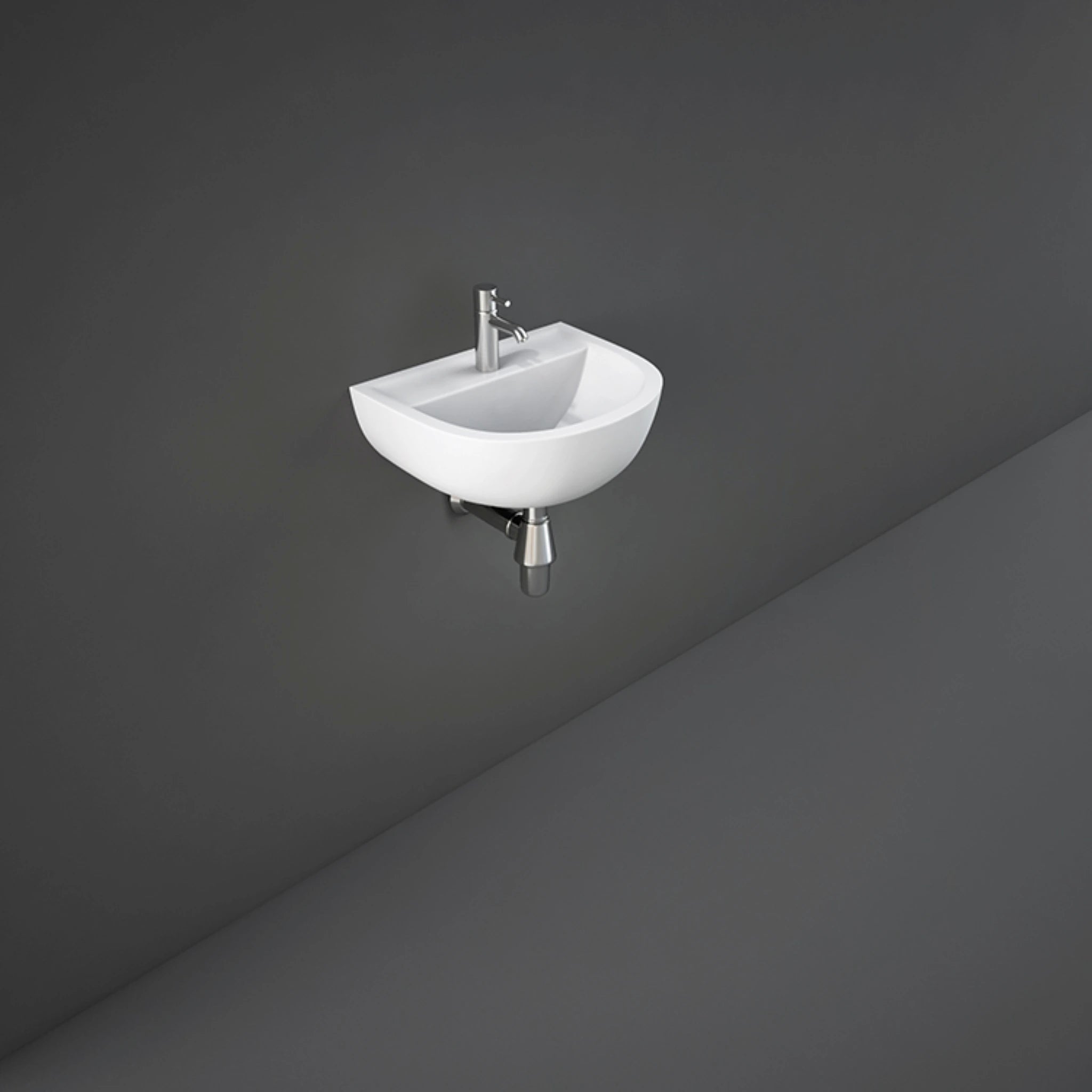 RAK Compact 38cm alpine white wall hung wash basin featuring an oval bowl shape and pre-drilled single tap hole.