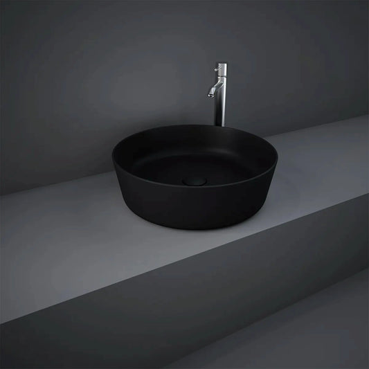 RAK-Feeling 42cm round countertop wash basin in a smooth Matt Black finish, highlighting its slim-rim design and modern spherical silhouette.
