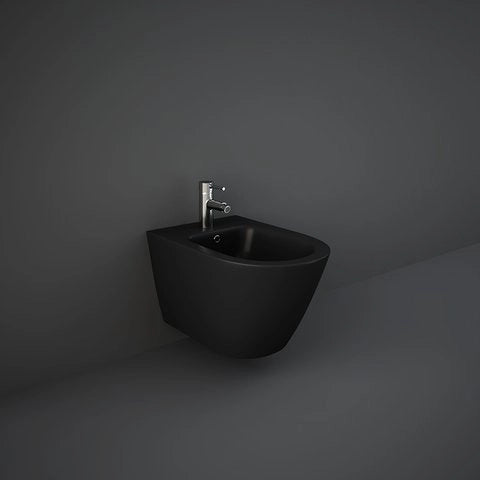 A front studio view of the RAK-Feeling Wall Hung Bidet in Matt Black, showcasing its smooth rectangular silhouette and hidden mounting system for a clean, floating appearance.