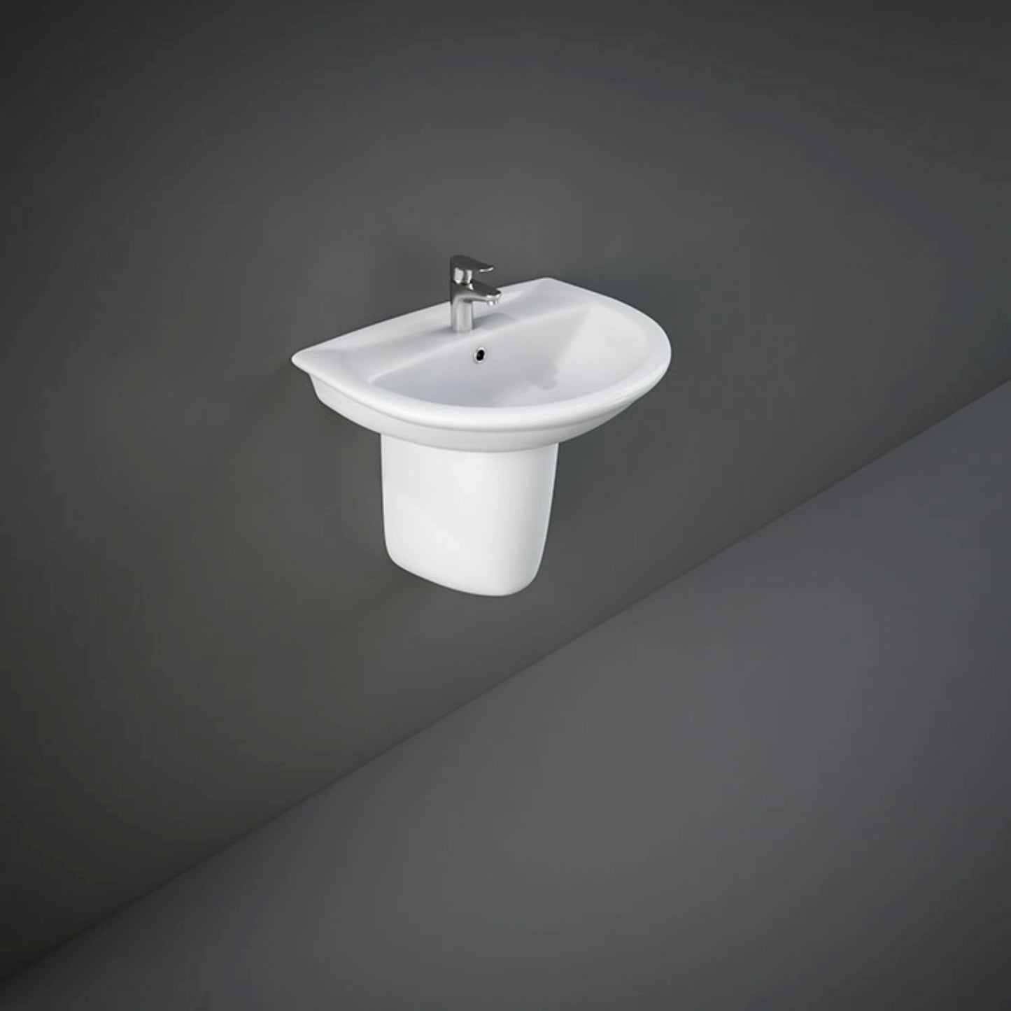 Front view of the 50cm RAK Ceramics Karla oval wash basin finished in Alpine White, supported by a matching wall-mounted ceramic half pedestal.