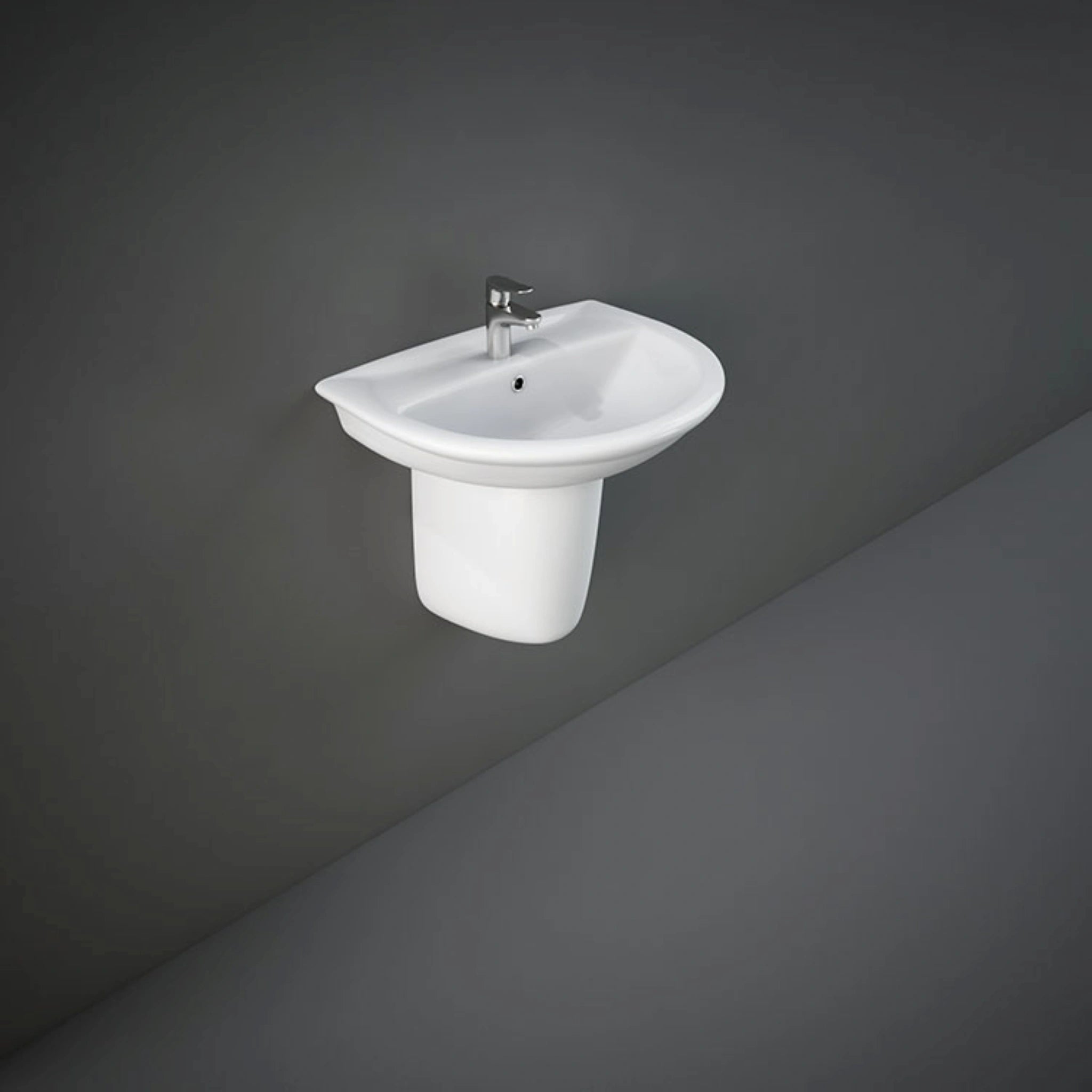 Front view of the 50cm RAK Ceramics Karla oval wash basin finished in Alpine White, supported by a matching wall-mounted ceramic half pedestal.