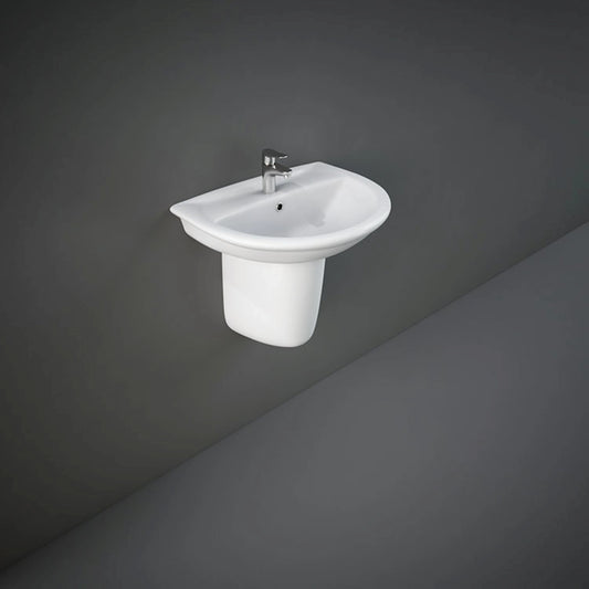 Front view of the 50cm RAK Ceramics Karla oval wash basin finished in Alpine White, supported by a matching wall-mounted ceramic half pedestal.