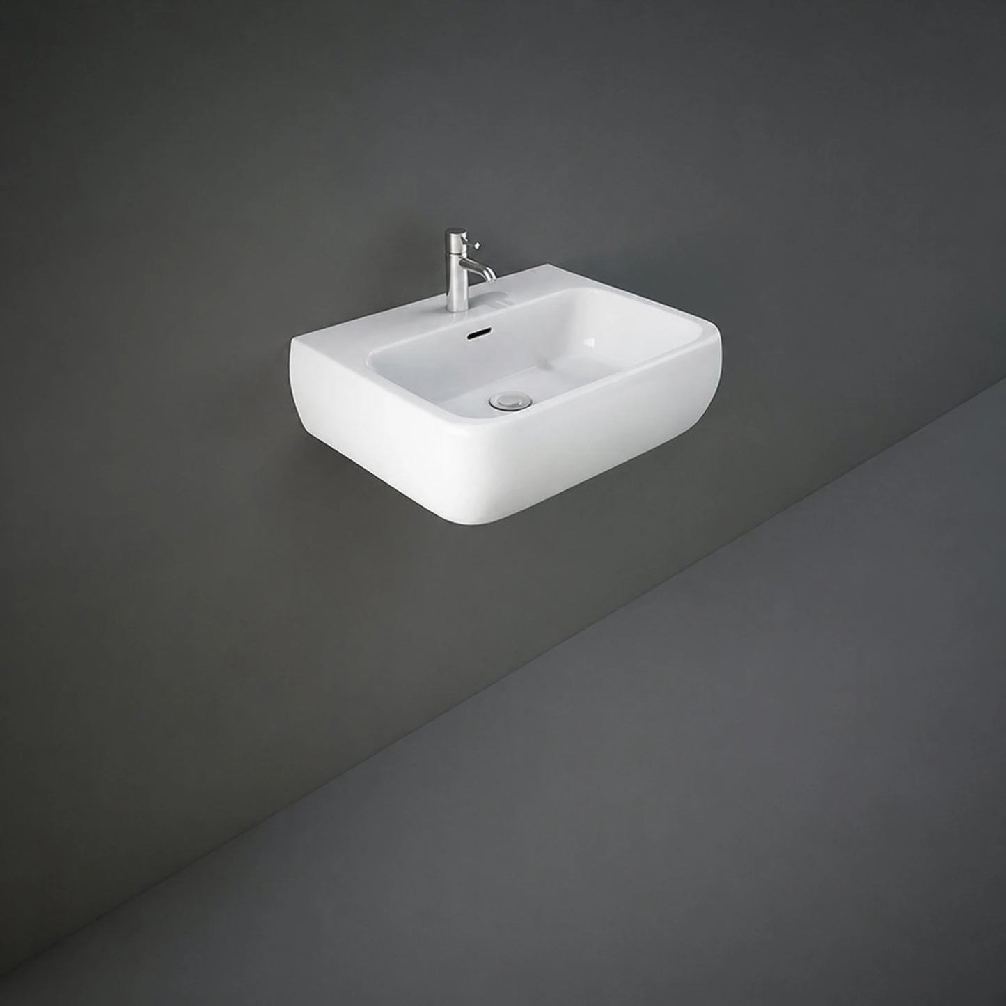 Front view of the 52cm RAK Ceramics Metropolitan rounded-rectangle wash basin in Alpine White, displaying its pre-drilled central single tap hole and integrated overflow.