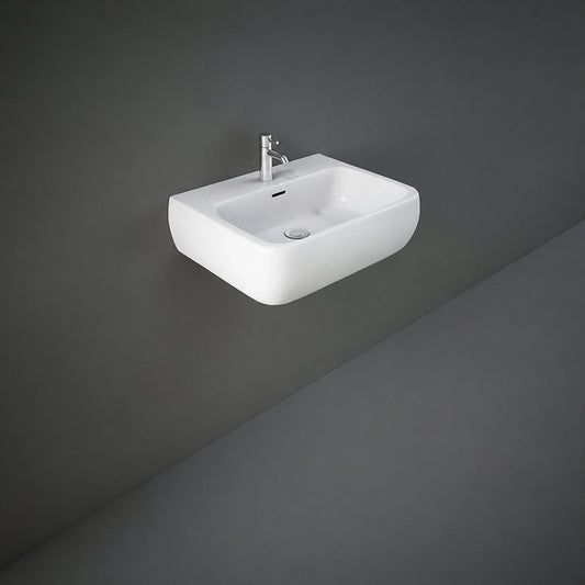 Front view of the 52cm RAK Ceramics Metropolitan rounded-rectangle wash basin in Alpine White, displaying its pre-drilled central single tap hole and integrated overflow.