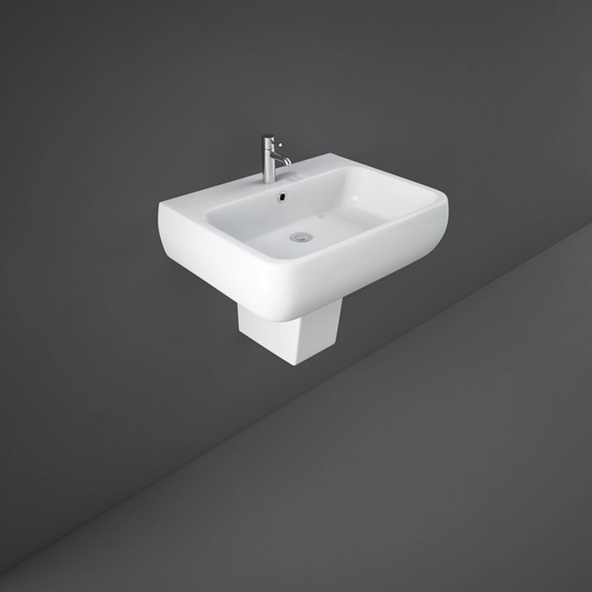 RAK Metropolitan 60cm alpine white wash basin paired with a sleek matching semi-pedestal shroud.