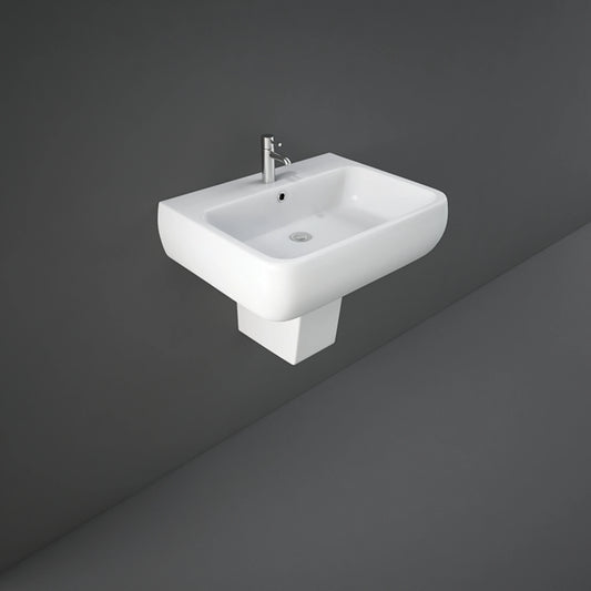 RAK Metropolitan 60cm alpine white wash basin paired with a sleek matching semi-pedestal shroud.