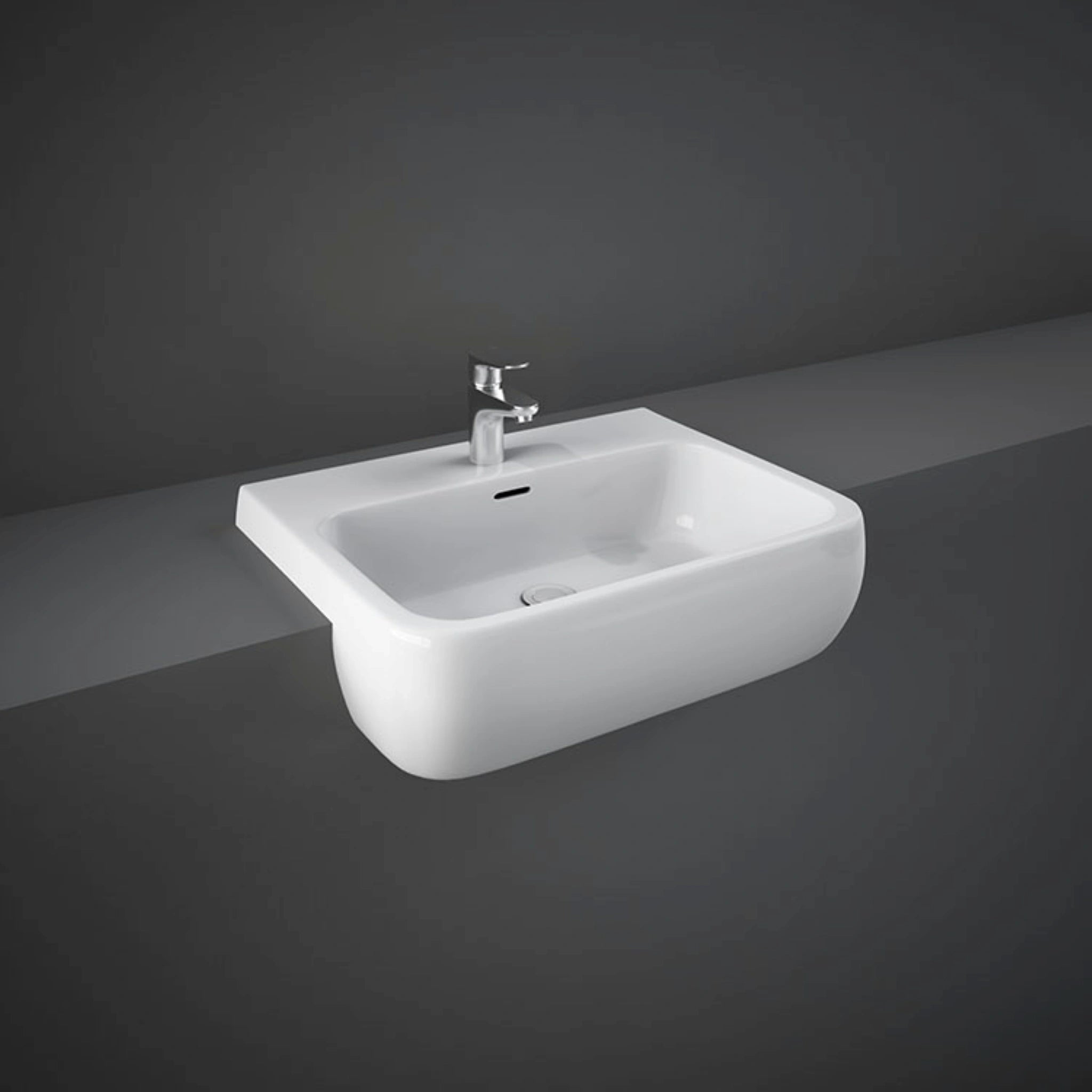 RAK-Metropolitan 52cm semi-recessed wash basin in Alpine White, displaying its pre-drilled central tap hole, integrated overflow, and distinctive forward-projecting design.