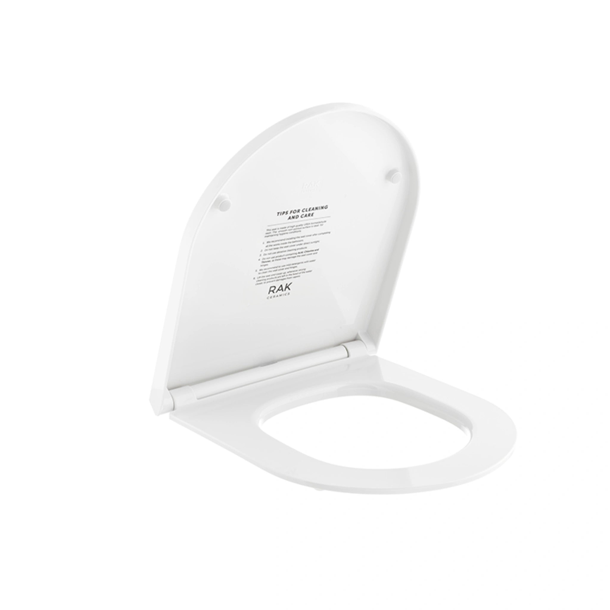 RAK Ceramics RAK-Des Urea soft-close toilet seat cover in Alpine White, featuring a sleek rounded-rectangle design and quick-release hinges.