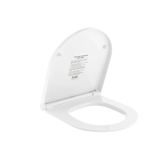 RAK Ceramics RAK-Des Urea soft-close toilet seat cover in Alpine White, featuring a sleek rounded-rectangle design and quick-release hinges.