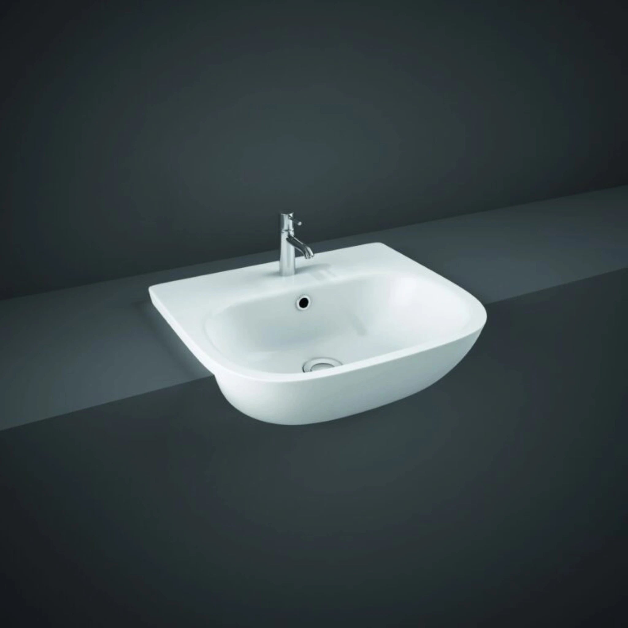 Front view of the 52cm RAK Ceramics Tonique semi-recessed rectangular wash basin in Alpine White, displaying its pre-drilled single central tap hole and integrated overflow.