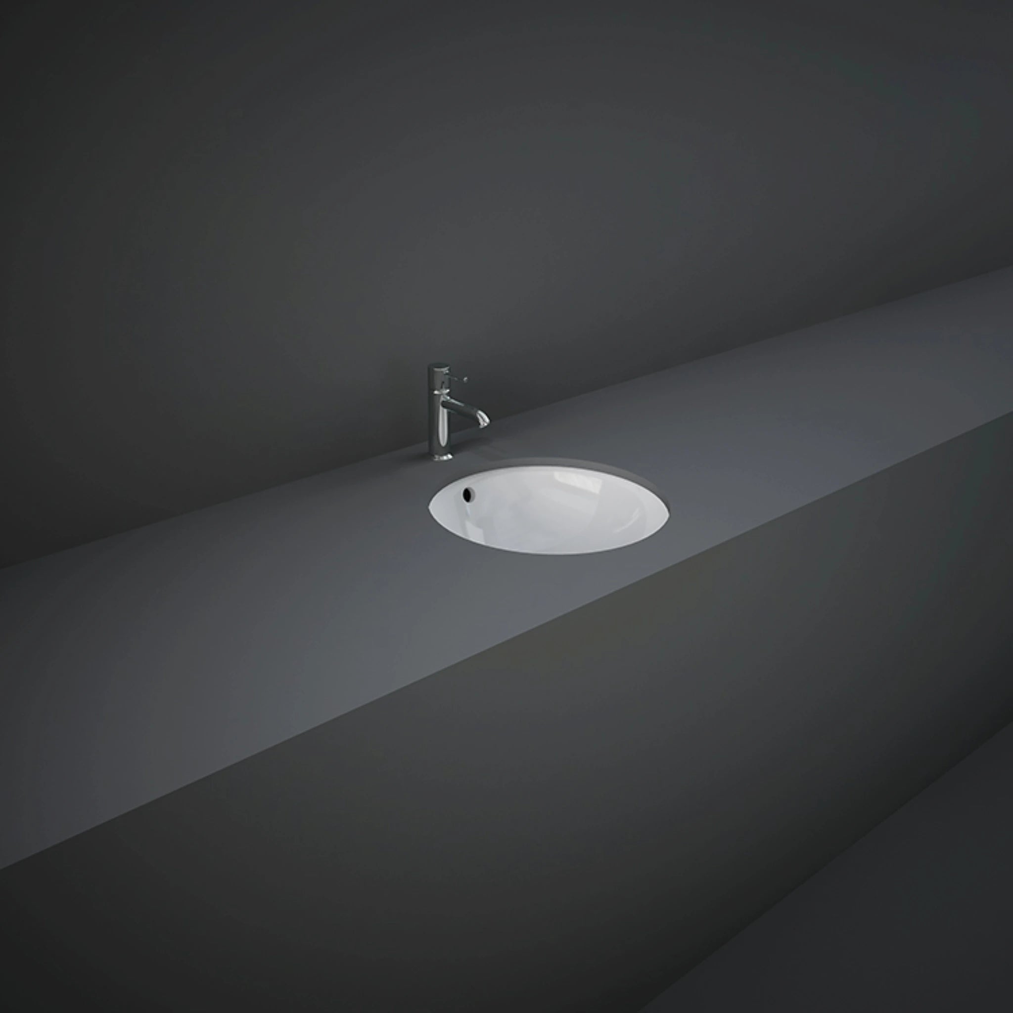 RAK-Variant 36cm round under-counter wash basin in glossy Alpine White, showing its rimless interior bowl construction and hidden undermount design.