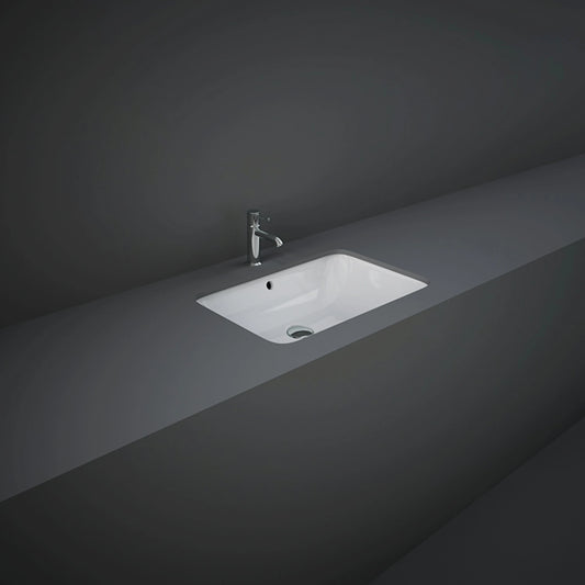 RAK-Variant 55cm rectangular under-counter wash basin in a glossy Alpine White finish, showcasing its clean rimless look and integrated undermount design.