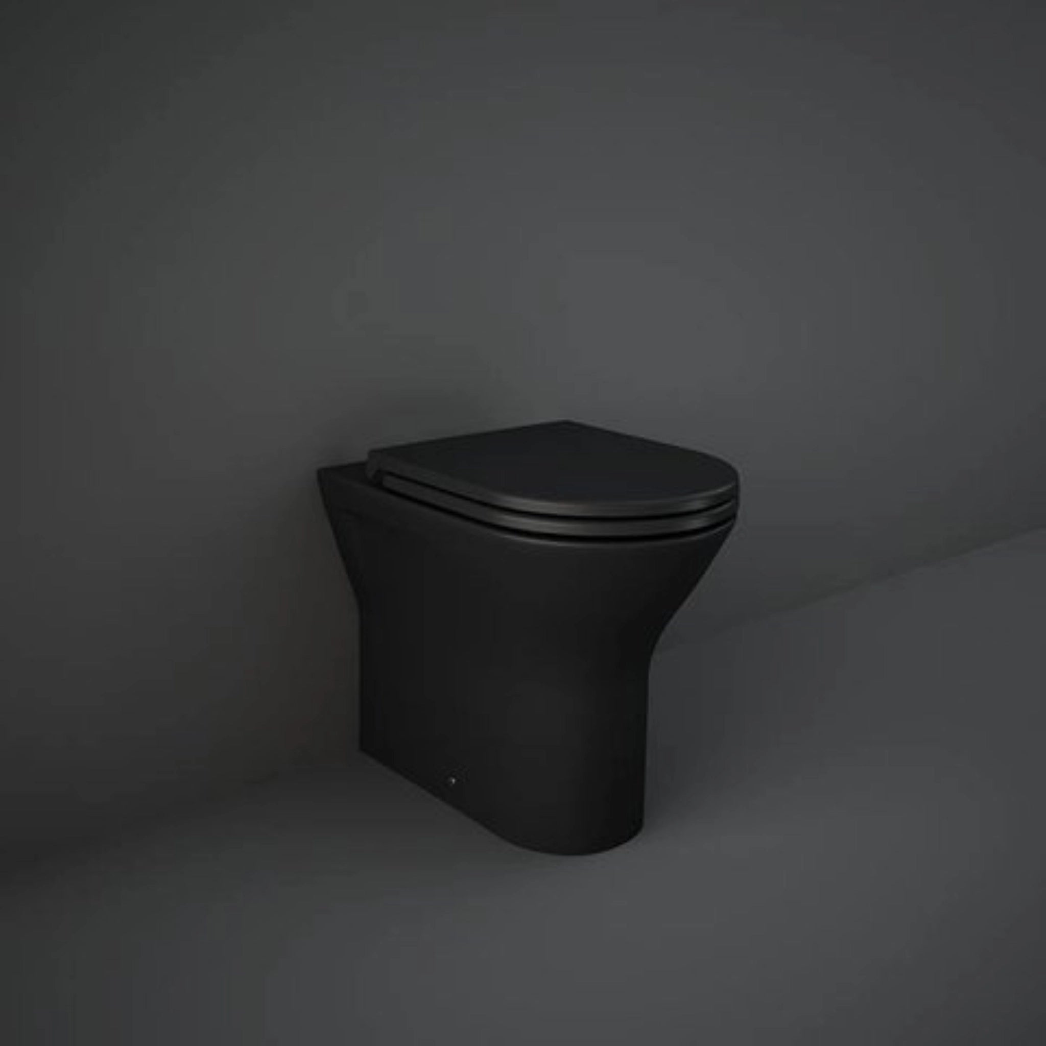 RAK-Resort RST19504A rimless back to wall water closet pan in Matt Black finish, 550mm oval design.