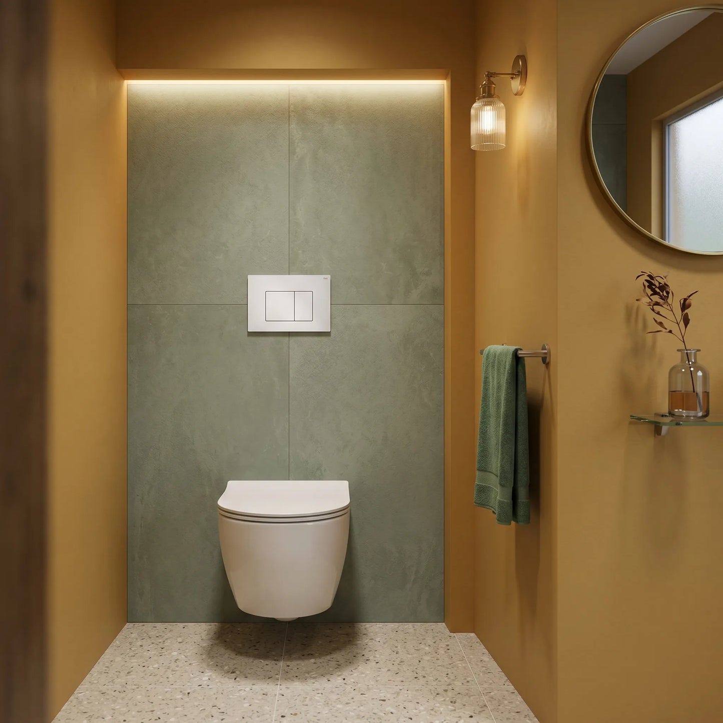 Minimalist bathroom design featuring a white RAK-Neofix push plate installed on a sage green tiled wall above a wall-hung toilet, complemented by mustard yellow walls and terrazzo flooring.