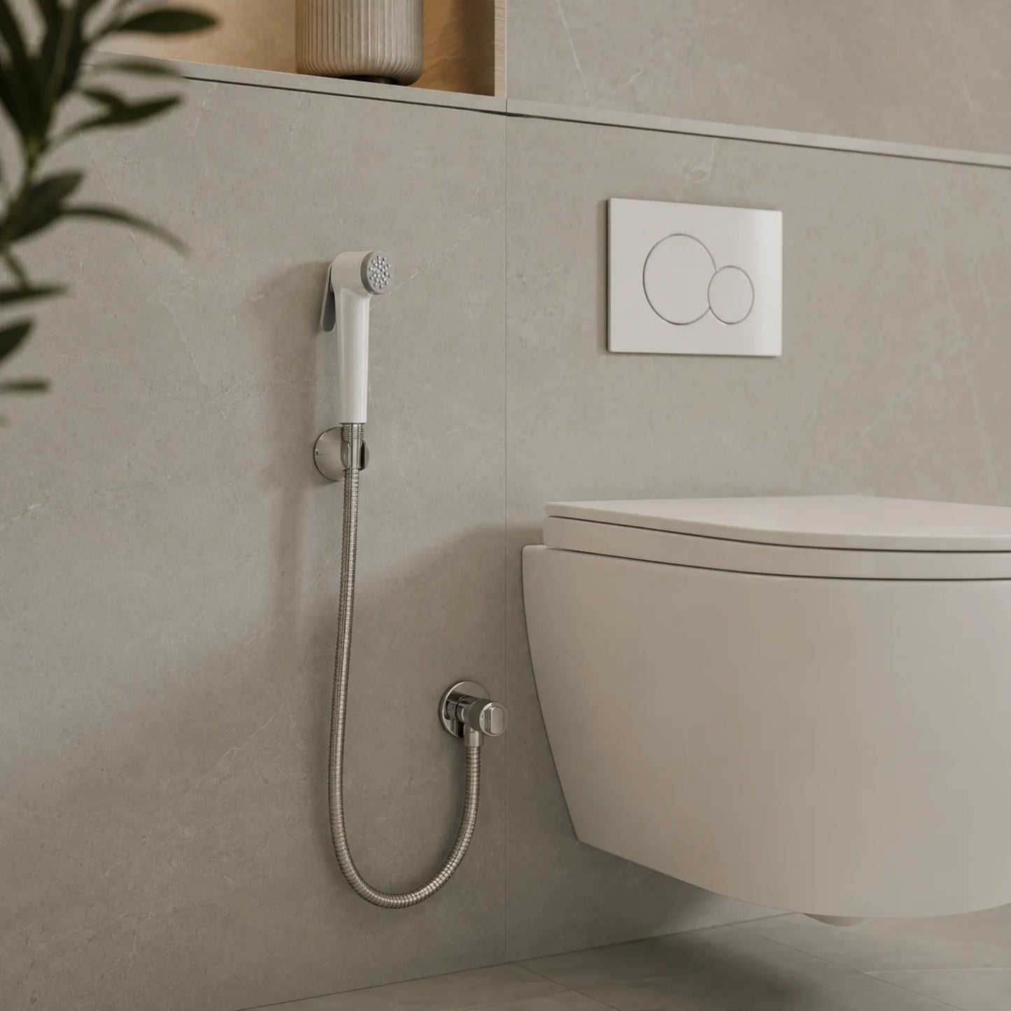 SANITAR RENA-W white shattaf bidet spray set with stainless steel hose mounted on wall beside a modern toilet