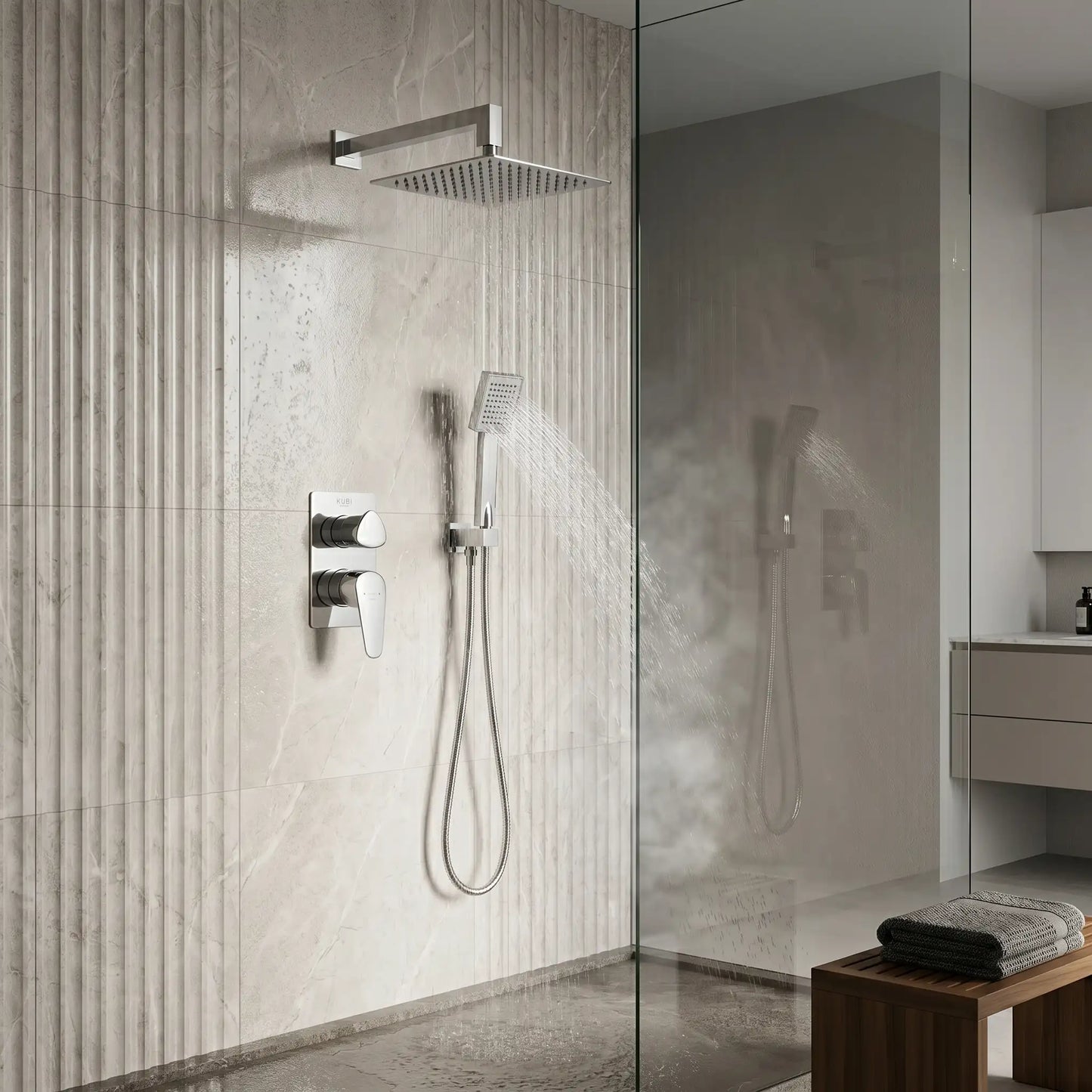 Modern luxury walk-in shower featuring the Strohm Teka Itaca concealed system with water flowing from both the overhead square rain shower and the handheld sprayer against a textured marble wall.